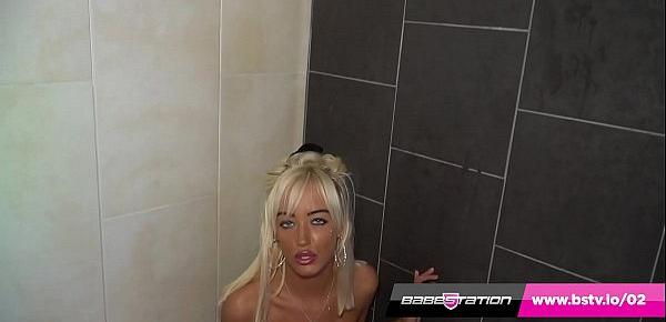  Skinny blonde with huge tits gets oiled up in the shower